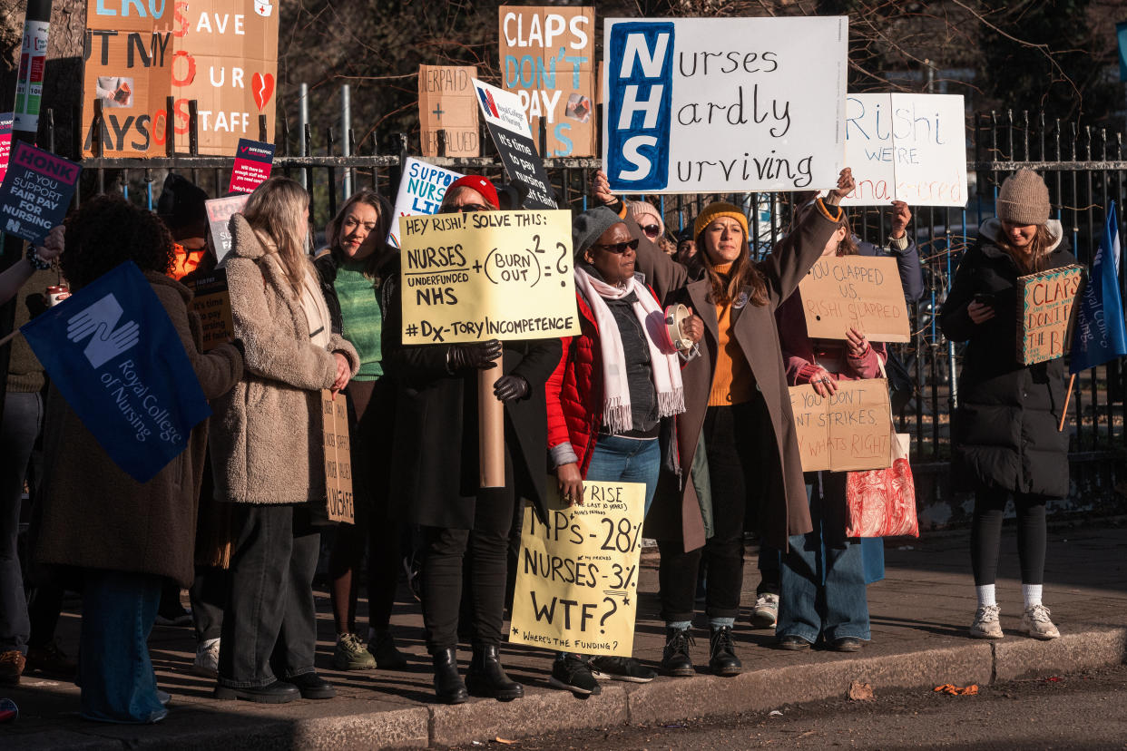 Nurses hold signs at an official picket line outside St George's Hospital in Tooting on 19 January 2023 in London, United Kingdom. Nurses in England from the Royal College of Nursing (RCN) are taking part in the fourth day of strikes over pay and working conditions. The government continues to refuse to discuss an improved pay rise for 2022-2023 with the RCN and other health unions. (photo by Mark Kerrison/In Pictures via Getty Images)