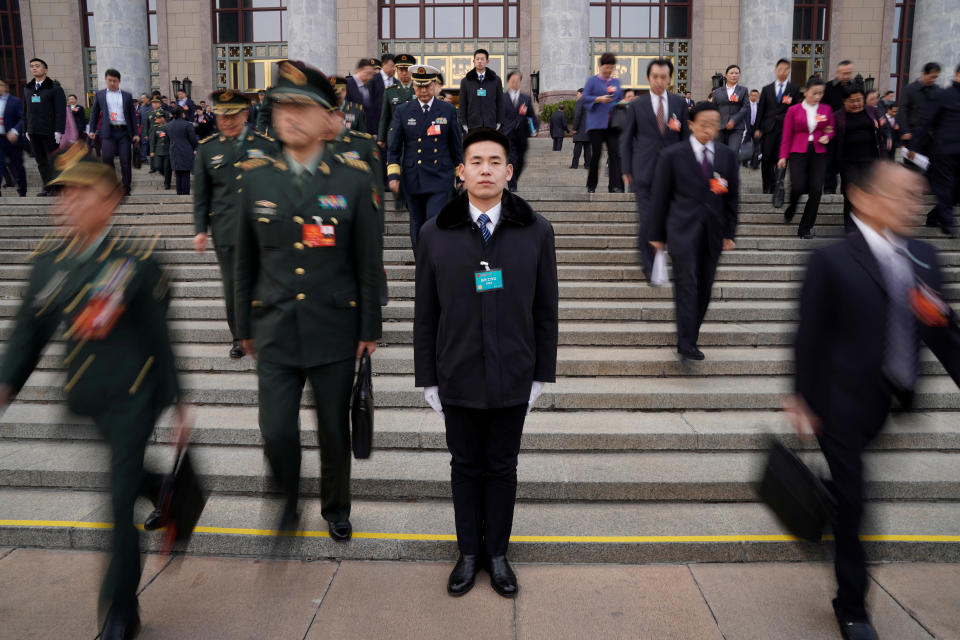 <p>Security personnel stand guard in front of the Great Hall of the People after the second plenary session of the National People’s Congress (NPC) in Beijing on March 9, 2018. (Photo: Jason Lee/Reuters) </p>