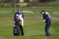 Russell Knox, of Scotland, chips the ball onto the sixth green of the Pebble Beach Golf Links during the third round of the AT&T Pebble Beach Pro-Am golf tournament Saturday, Feb. 13, 2021, in Pebble Beach, Calif. (AP Photo/Eric Risberg)