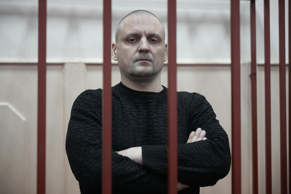 Sergei Udaltsov, Russian left-wing political activist stands in a cage in a courtroom in Moscow, Russia, Friday, Jan. 12, 2024. Sergei Udaltsov, a Russian pro-war activist and critic of President Vladimir Putin, was remanded into custody Thursday over alleged terrorism offenses, his lawyer told the Russian state news agency Tass. (AP Photo/Alexander Zemlianichenko)