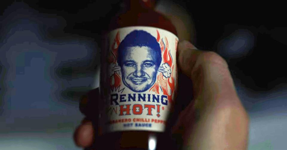 Jeremy Renner's face on a hot sauce container