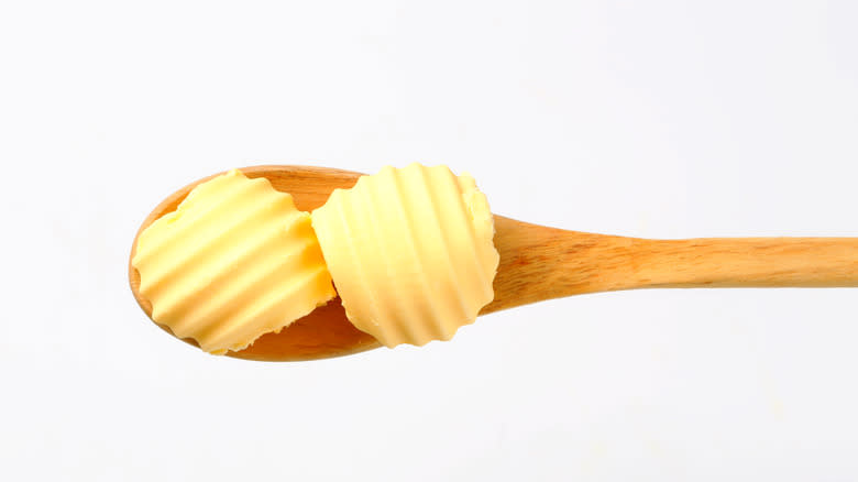 wooden spoon with butter curls