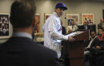 Luis Rojas, center, looks at New York Mets vice president & general manager Brodie Van Wagenen, left, as he express appreciation being named the new manager of the Mets during a news conference, Friday, Jan. 24, 2020, in New York. (AP Photo/Bebeto Matthews)