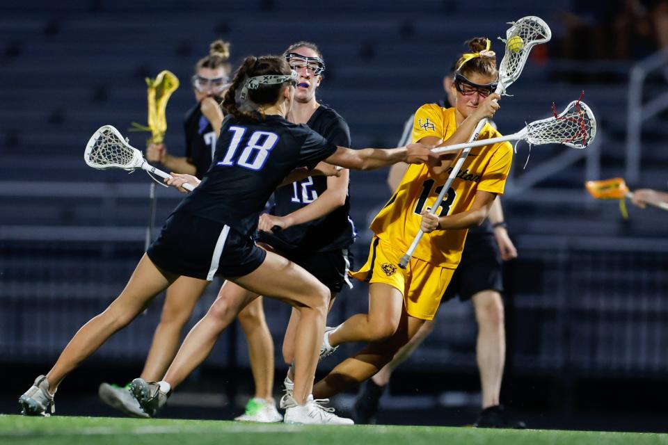 Olentangy Liberty’s Madeline Pohmer (18) tries to stop Upper Arlington’s Lilly Boyle during their game Tuesday night.