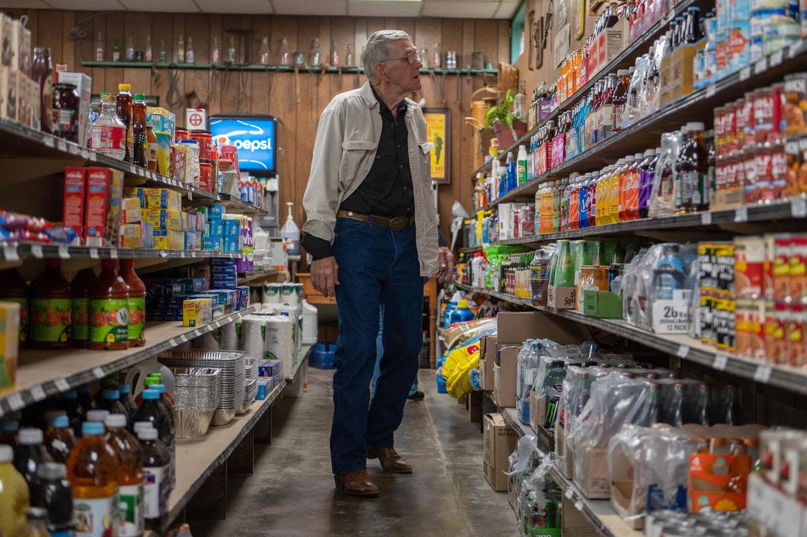David Long of Topeka takes a break from the dance to browse The Mildred Store’s soda pop aisle.