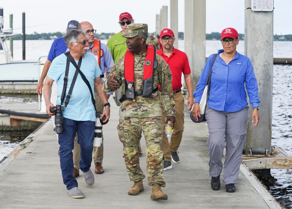 Brig. Gen. Jason Kelly, of the U.S. Army Corps of Engineers South Atlantic Division, and Col. James Booth, of the Jacksonville District, take a tour of the South Fork of the St. Lucie River with Stuart Mayor Merritt Matheson, environmental groups and county representatives Thursday, June 9, 2022, in Martin County. "The main reason for this is to get the Army Corps out on the water," said Matheson. "Showing someone physically what they are trying to fix, what they're striving to keep, improve or showing them the problems that have occurred has a real impact."