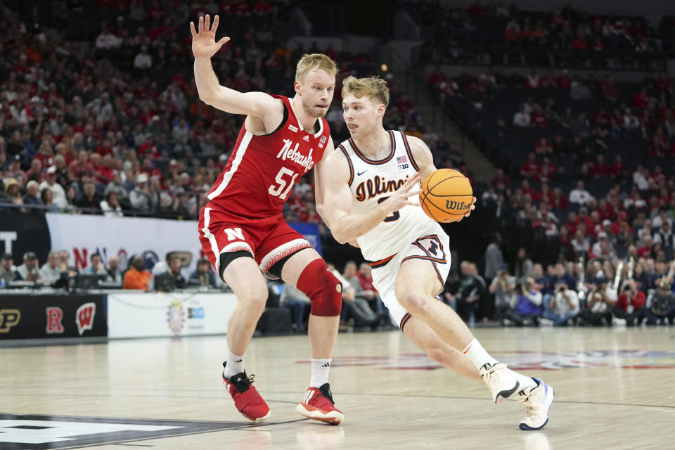 Illinois forward Marcus Domask works toward the basket as Nebraska forward Rienk Mast (51) defends during the first half of an NCAA college basketball game in the semifinal round of the Big Ten Conference tournament, Saturday, March 16, 2024, in Minneapolis. (AP Photo/Abbie Parr)