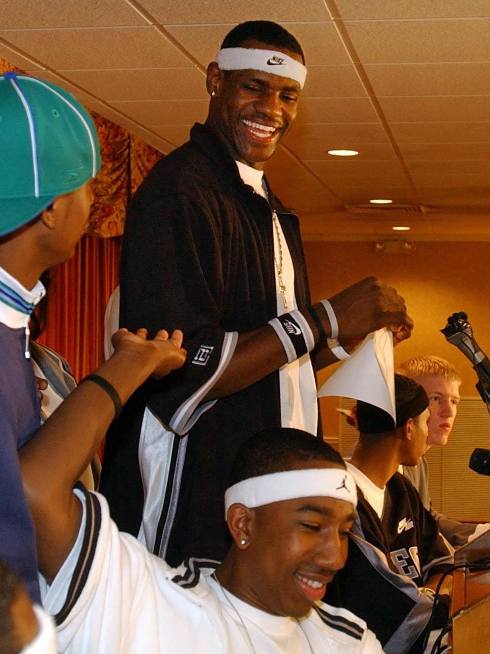 LeBron James jokes with Dru Joyce III and other teammates at a news conference moments after the Cleveland Cavs won the NBA Draft Lottery.