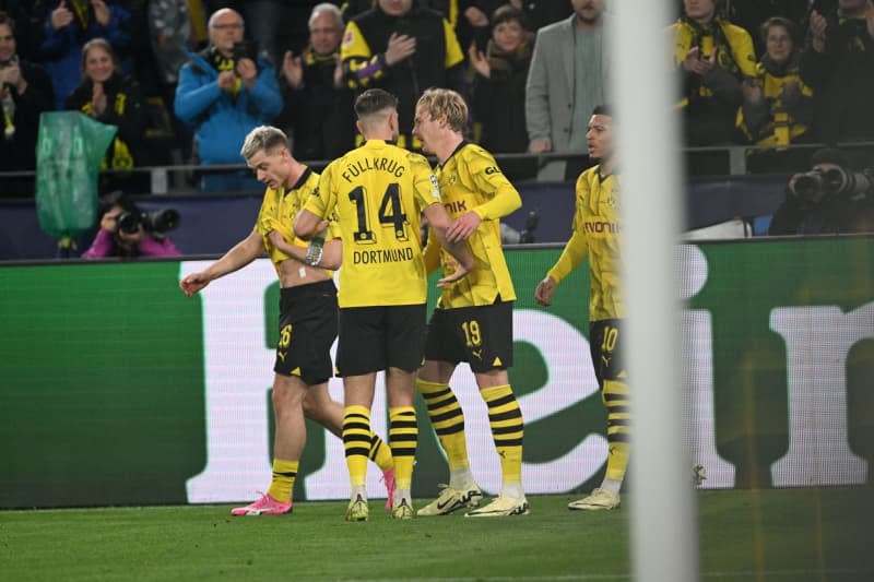 Dortmund's Julian Brandt (2nd R) celebrates scoring his side's first goal with teammates (L-R) Julien Duranville, Niclas Fuellkrug and Jadon Sancho during the UEFA Champions League quarter-finals, second leg soccer match between Borussia Dortmund and Atletico Madrid at Signal Iduna Park. Federico Gambarini/dpa