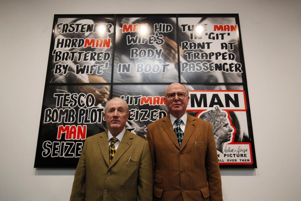 British artists Gilbert & George pose in front of their artwork in the White Cube gallery in Hong Kong Thursday, March 1, 2012. Britain's White Cube gallery, known as an early champion of provocative British artists Damien Hirst and Tracey Emin, launched its Hong Kong branch on Thursday, becoming the latest Western gallery to open an Asian outpost in pursuit of China's booming art market.  (AP Photo/Kin Cheung)