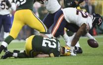 Sep 9, 2018; Green Bay, WI, USA; Green Bay Packers quarterback Aaron Rodgers (12) is sacked in the second quarter during the game against the Chicago Bears and had to leave the game with an injury at Lambeau Field. Mandatory Credit: Benny Sieu-USA TODAY Sports