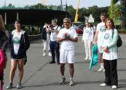 Mayor of London Sadiq Khan (centre) at the All England Lawn Tennis Club in Wimbledon, south west London, during an event to thank members of the NHS, TfL and care workers for their service during the coronavirus pandemic.