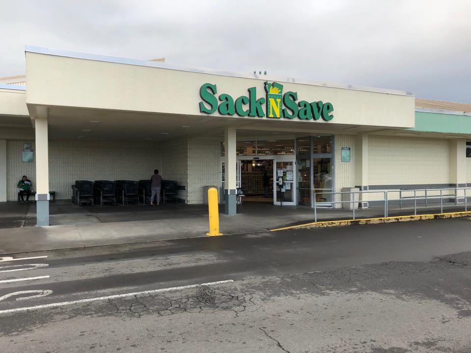 The entrance to a Sack N Save store in Hilo, Hawaii, featuring the grocery chain's green-and-yellow sign