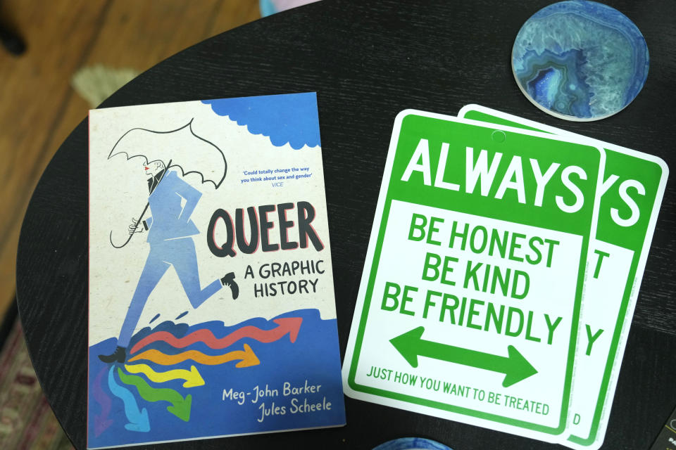 Reading material and a placard sit on a table at the office of TransSOCIAL, Thursday, July 27, 2023, in Miami. The organization works to promote unity and increase transgender understanding in the community. About 171,000 of the more than 1.3 million transgender adults in the United States are aged 65 and older, according to numbers compiled by the Williams Institute at the UCLA School of Law. (AP Photo/Lynne Sladky)