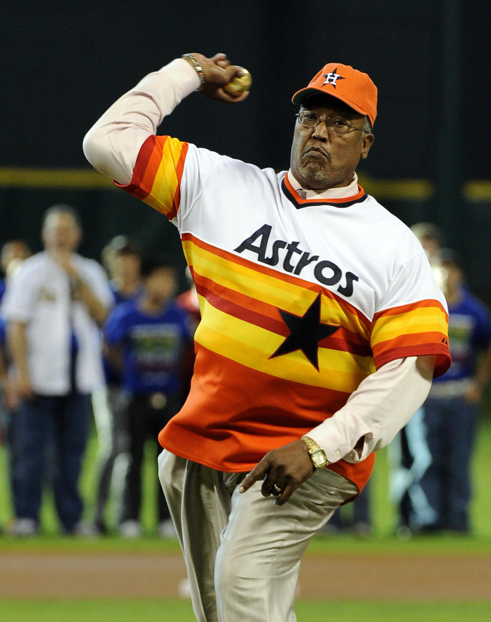 FILE - In this June 1, 2012, file photo, former Houston Astros pitcher J.R. Richard throws out the ceremonial first pitch before the Astros' baseball game against the Cincinnati Reds in Houston. Richard, a huge, flame-throwing right-hander who spent 10 years with the Astros before his career was cut short by a stroke, has died, the team announced, Thursday, Aug. 5, 2021. He was 71. (AP Photo/Pat Sullivan, File)