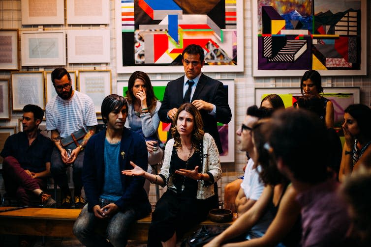 A group of people in a meeting.