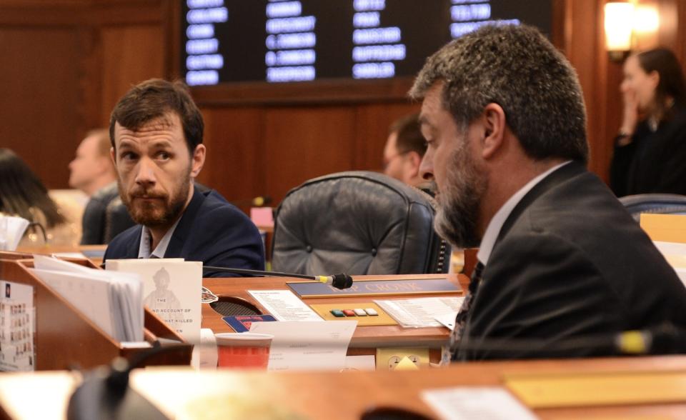 Rep. Zack Fields, D-Anchorage, listens to Rep. Mike Cronk, R-Tok, during a break in the House floor session Wednesday, May 15, 2024. (Photo by James Brooks/Alaska Beacon)