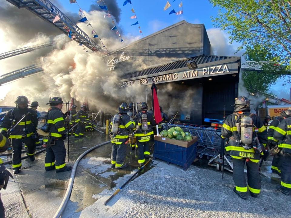 The flames quickly spread from the food store to four adjacent apartment buildings. David Burns/@FD4D