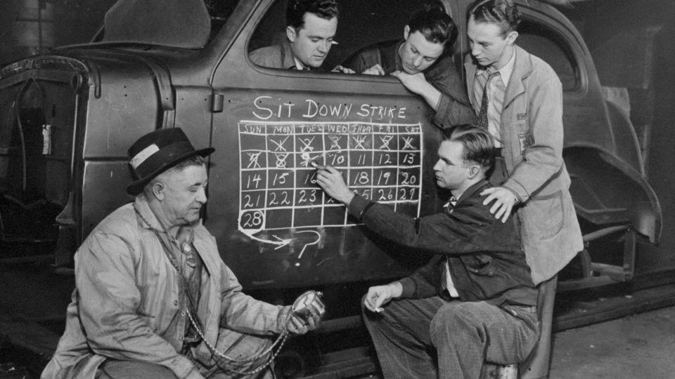 Strikers cross off number of days they have been on the sit-down strike at General Motors' Chevrolet auto plant in Flint on February 10, 1937. - Tom Watson/NY Daily News Archive/Getty Images