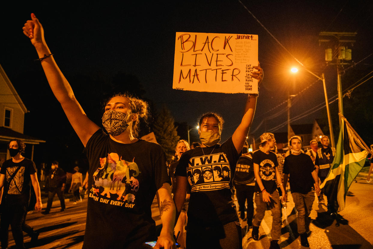 Protesters take to the streets in Kenosha, Wis., where police shot Jacob Blake — in front of his three children — leaving him partially paralyzed. (Photo: Brandon Bell/Getty Images)