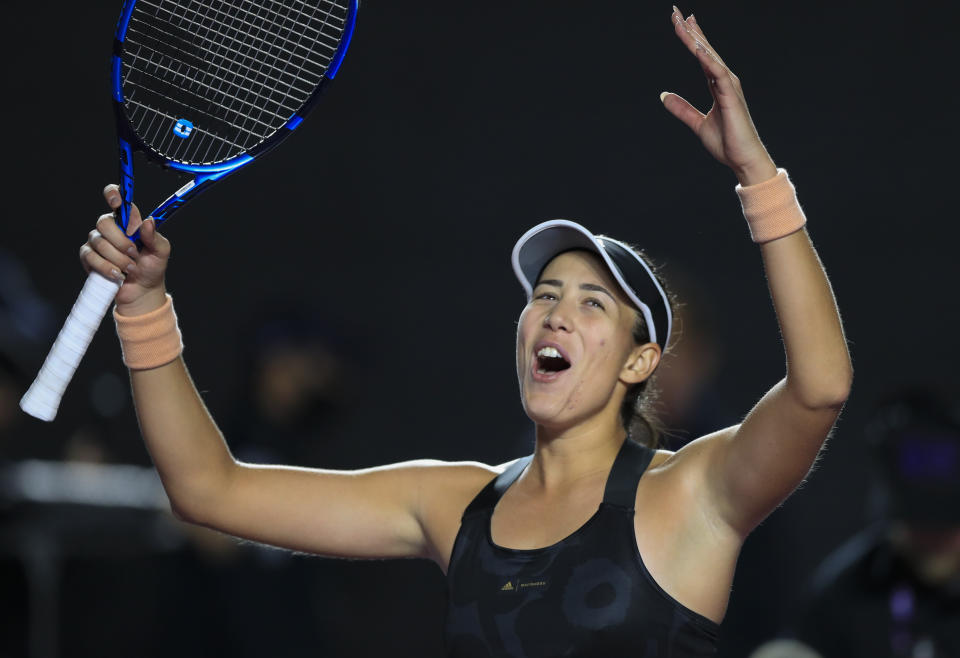 Garbiñe Muguruza, of Spain, celebrates after defeating Czech Republic's Barbora Krejcikova during a WTA Finals tennis match in Guadalajara, Mexico, Friday, Nov. 12, 2021. (AP Photo/Refugio Ruiz)