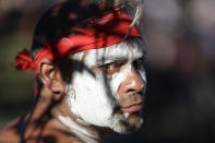 Russell Dawson of the Koomurri Aboriginal Dancers participates in a smoking ceremony during Australia Day ceremonies in Sydney, Tuesday, Jan. 26, 2021. (AP Photo/Rick Rycroft)