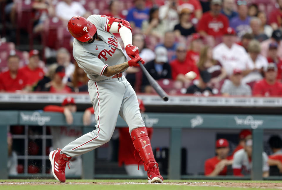 Philadelphia Phillies Nick Castellanos hits a home run against the Cincinnati Reds during the third inning of a baseball game in Cincinnati Tuesday, Aug. 16, 2022. (AP Photo/Paul Vernon)