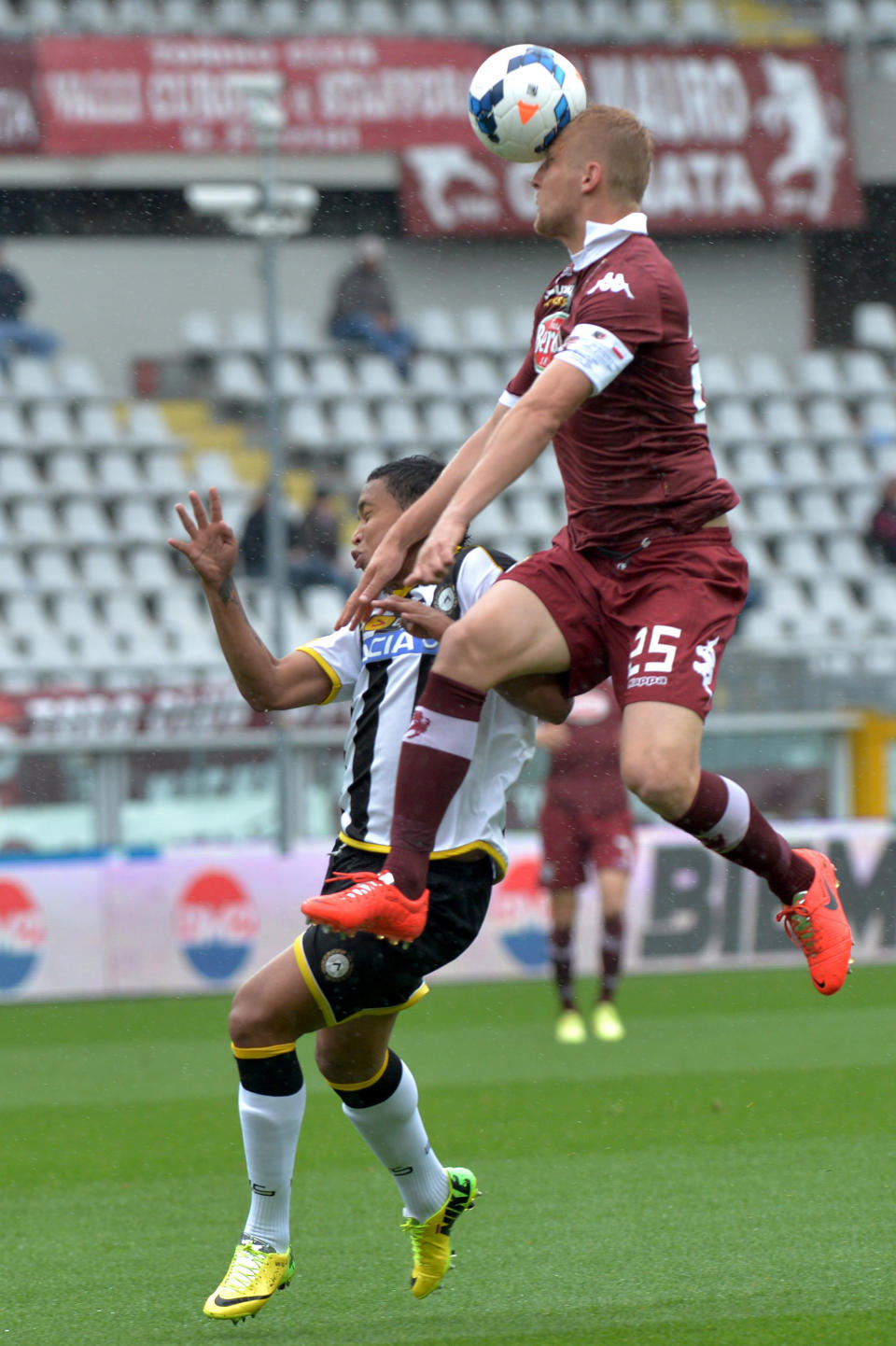 Torino defender Kamil Glik, right, and Udinese forward Luis Muriel vie for the ball during a Serie A soccer match between Torino and Udinese at the Olympic stadium, in Turin, Italy, Sunday, April 27, 2014. (AP Photo/ Massimo Pinca)