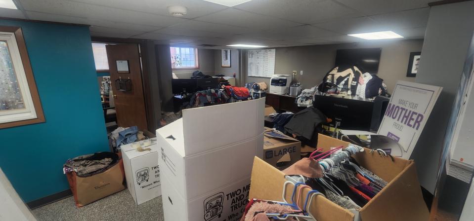 The office is full of clothing donations at Two Men and a Truck in April, 2022.