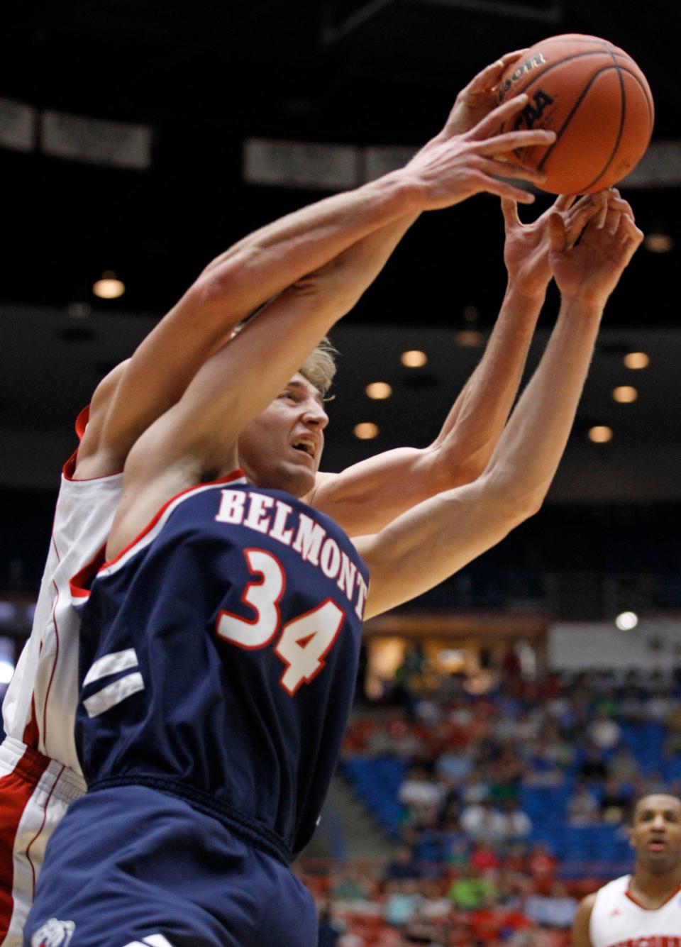 Belmont's Mick Hedgepeth (34) is shadowed by a Wisconsin defender in a fight for the ball during a Southeast Regional NCAA college basketball tournament second-round game Thursday, March 17, 2011, in Tucson, Ariz.  (AP Photo/Chris Carlson)