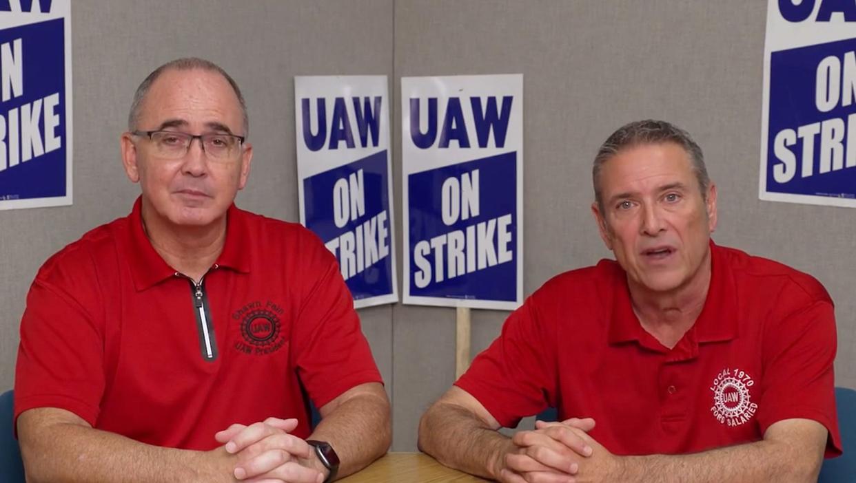 In this frame capture from a UAW video, UAW President Shawn Fain, left, and UAW Vice President Chuck Browning announce that Ford reached a tentative agreement with the UAW after 41 days on strike.
