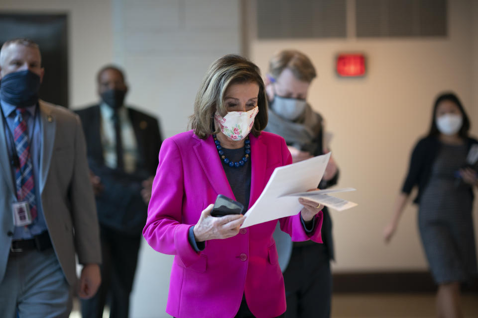 FILE - In this Thursday, Feb. 25, 2021 file photo, Speaker of the House Nancy Pelosi, D-Calif., walks to a news conference as the Democratic-led House prepares to pass a bill that enshrines protections in the nation's labor and civil rights laws for LGBTQ people, a top priority of President Joe Biden, at the Capitol in Washington. It probably needs at least 10 Republican votes to prevail in the closely divided Senate – and as of early June 2021 has no GOP co-sponsors. (AP Photo/J. Scott Applewhite, File)