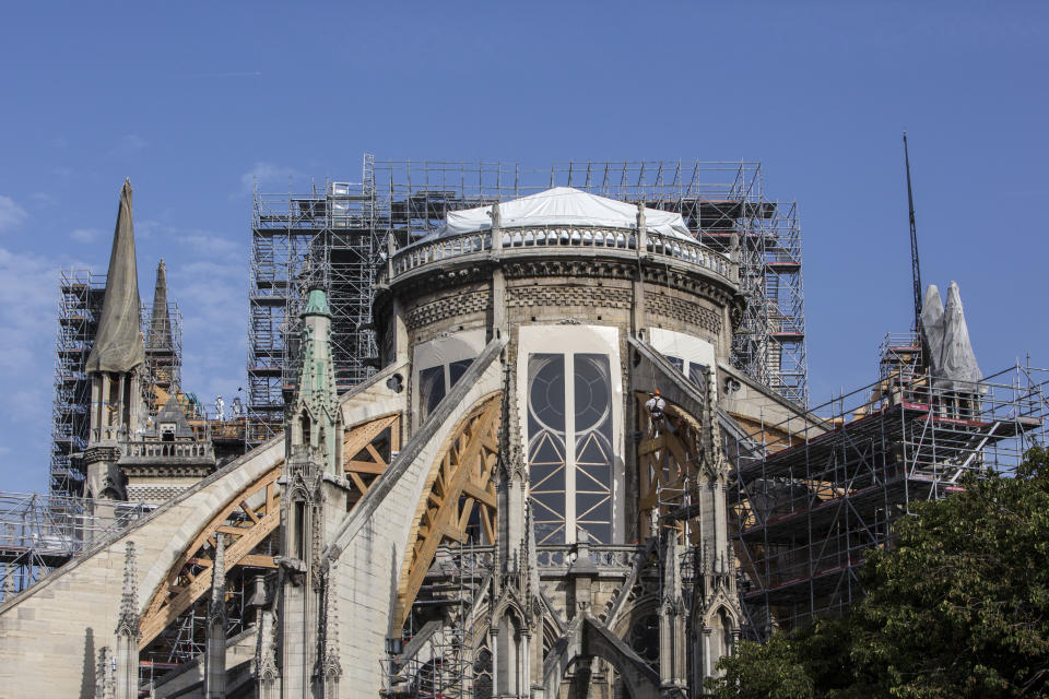 Workers are pictured during preliminary work to repair the fire damage at the Notre-Dame de Paris Cathedral, in Paris, France, Wednesday, July 24, 2019. (AP Photo/Rafael Yaghobzadeh, Pool)