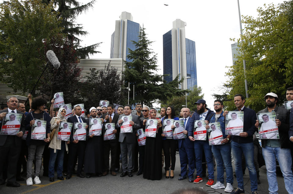 Members of the Turkish-Arab journalist Association hold posters with photos of missing Saudi writer Jamal Khashoggi, as they hold a protest near the Saudi Arabia consulate in Istanbul, Monday, Oct. 8, 2018. Khashoggi, 59, went missing on Oct 2 while on a visit to the consulate in Istanbul for paperwork to marry his Turkish fiancée. The consulate insists the writer left its premises, contradicting Turkish officials. He had been living since last year in the U.S. in a self-imposed exile, in part due to the rise of Prince Mohammed, the son of King Salman. (AP Photo/Lefteris Pitarakis)