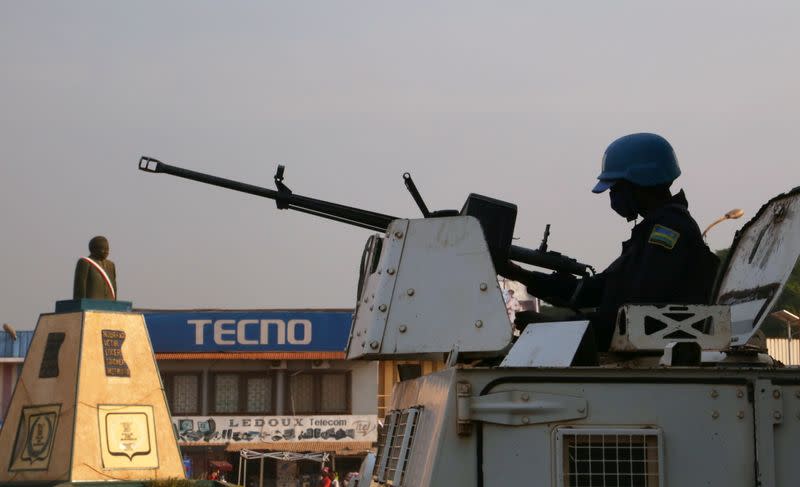 A MINUSCA armoured personnel carrier keep guard as they patrol the streets ahead of the upcoming elections in Bangui