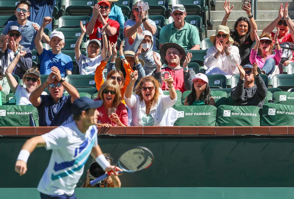 Andy Murray fist pumps and celebrates a winning point as tennis fans root him on at the BNP Paribas Open on March 11.