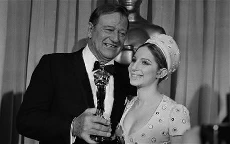 Barbra Streisand presented John Wayne with his Oscar for Best Actor for True Grit  - AP