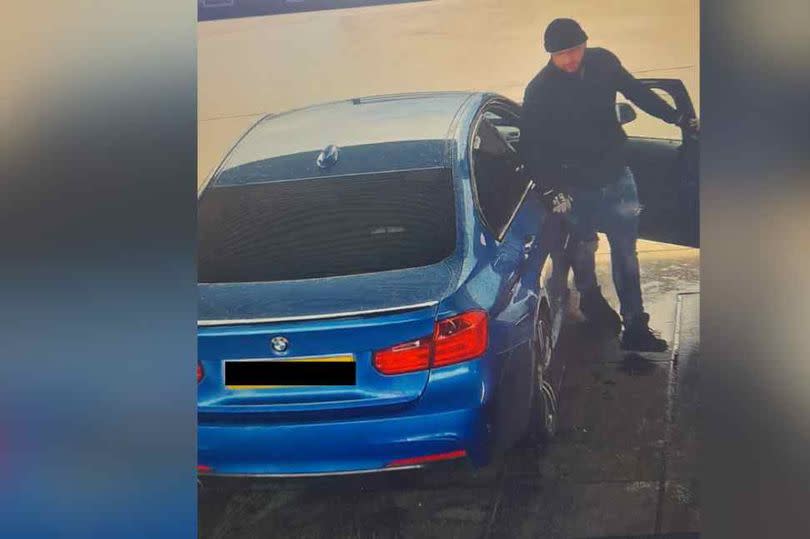 This is the CCTV image that police have released in connection with the theft of fuel. It shows a man and  a car with blacked out number plates