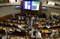 A view of the room is seen as lawmakers argue over a possible change in law that would allow President Horacio Cartes to run for re-election, in Asuncion, Paraguay March 28, 2017. REUTERS/Jorge Adorno