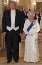 <p>Queen Elizabeth paired a ruby tiara and ruby necklace with a white state evening gown by Angela Kelly. The dress features crystal-centered daisies in its design.</p>