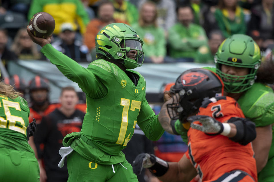 Oregon quarterback Anthony Brown (13) passes during the first quarter of an NCAA college football game against Oregon State, Saturday, Nov. 27, 2021, in Eugene, Ore. (AP Photo/Andy Nelson)