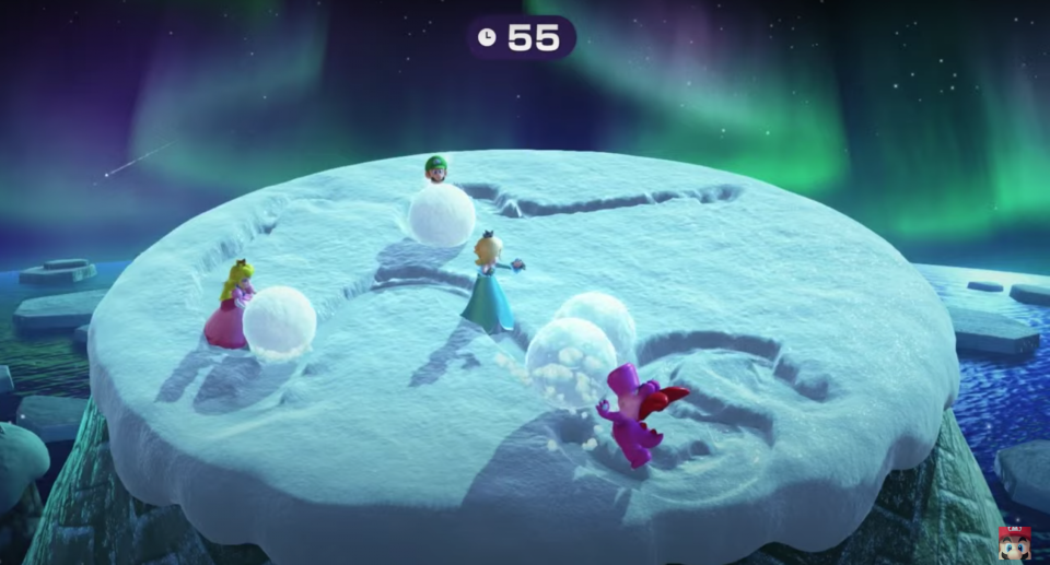 Mario Party characters push big snowballs on the top of a mountain.