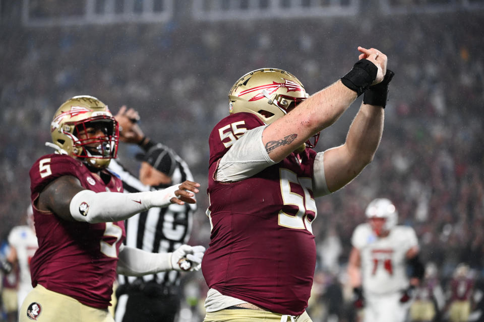 Dec 2, 2023; Charlotte, NC, USA; Florida State Seminoles defensive lineman Braden Fiske (55) gestures to his ring finger after sacking Louisville Cardinals quarterback <a class="link " href="https://sports.yahoo.com/ncaaf/players/286708/" data-i13n="sec:content-canvas;subsec:anchor_text;elm:context_link" data-ylk="slk:Jack Plummer;sec:content-canvas;subsec:anchor_text;elm:context_link;itc:0">Jack Plummer</a> (not pictured) in the fourth quarter at Bank of America Stadium. Mandatory Credit: Bob Donnan-USA TODAY Sports