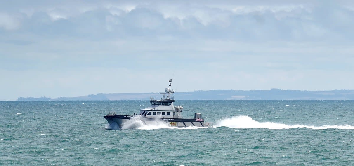 Border Force vessel Defender carries a group of people thought to be migrants in to Dover, Kent, following a small boat incident in the Channel. Picture date: Tuesday August 23, 2022. (Gareth Fuller/PA) (PA Wire)