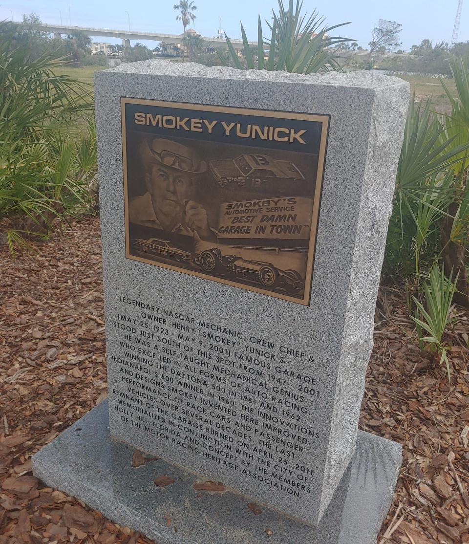 The new monument alongside the old location of the "Best Damn Garage in Town."