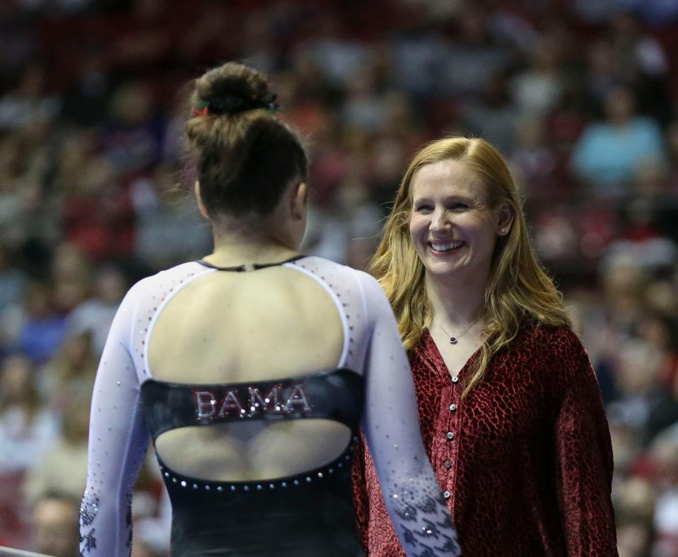 Feb 24, 2023; Tuscaloosa, AL, USA;  Alabama head coach Ashley Johnston talks to Alabama gymnast Gabby Gladieux  before she competes on the balance beam at Coleman Coliseum during the meet against LSU.