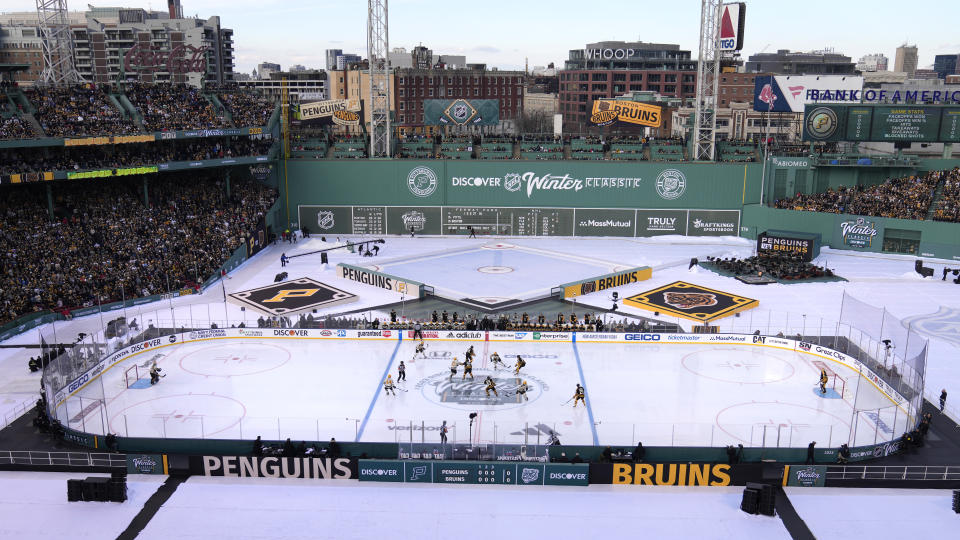 The Pittsburgh Penguins play against the Boston Bruins during the first period of the NHL Winter Classic hockey game at Fenway Park, Monday, Jan. 2, 2023, in Boston. (AP Photo/Charles Krupa)