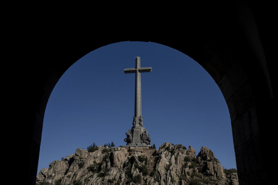 In this Thursday, Oct. 10, 2019 photo, the Valley of the Fallen mausoleum is seen near El Escorial, outskirts of Madrid, Spain. After a tortuous judicial and public relations battle, Spain's Socialist government has announced that Gen. Francisco Franco's embalmed body will be relocated from a controversial shrine to a small public cemetery where the former dictator's remains will lie along his deceased wife. (AP Photo/Bernat Armangue)