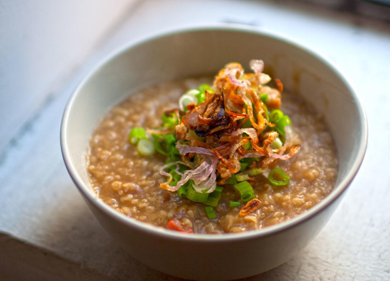 Congee made with oxtail, with scallions, fried shallots, and fried dried shrimp garnish