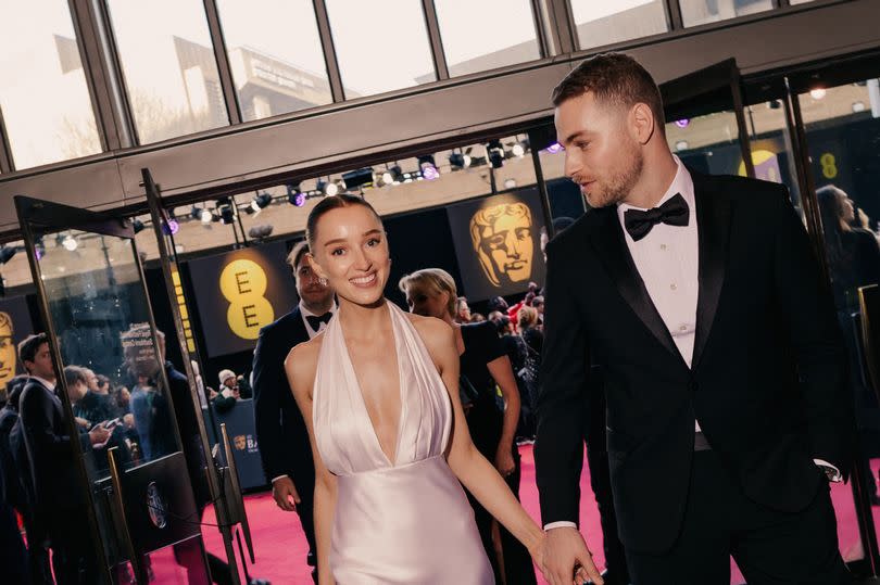 Phoebe Dynevor and Cameron Fuller attend the EE BAFTA Film Awards 2024